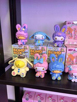 Surprise blind box with cute cartoon characters inside.