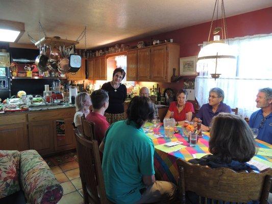 Jane Butel giving the history of the items to be cooked for a Green chile Fiesta  class.