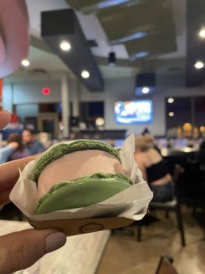 Macaron strawberry ice cream sandwhich with KPop videos in the background