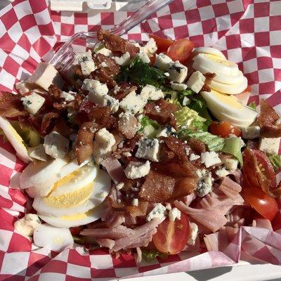 Best Cobb salad I've ever had! Loaded with chicken, bacon, eggs, bleu cheese, fresh greens, sweet tomatoes bleu cheese dressing on the side.