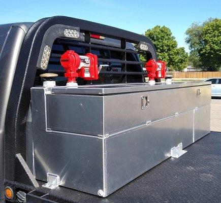 Combo fuel and hydraulic aluminum tank, with storage box on top.