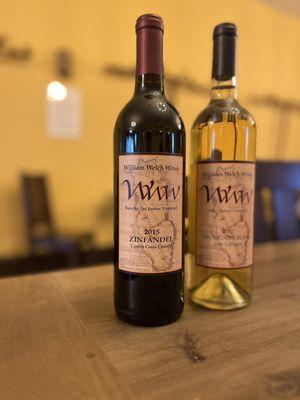 Zinfandel and Sauvignon Blanc bottles at tasting table