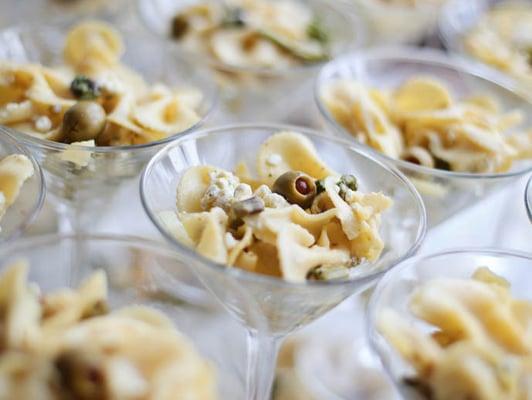 Pasta salad served in martini glasses.