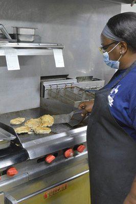 Owner, Marcella McClarin on the grill