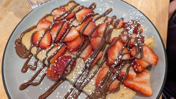 Nutella crepes with strawberries added