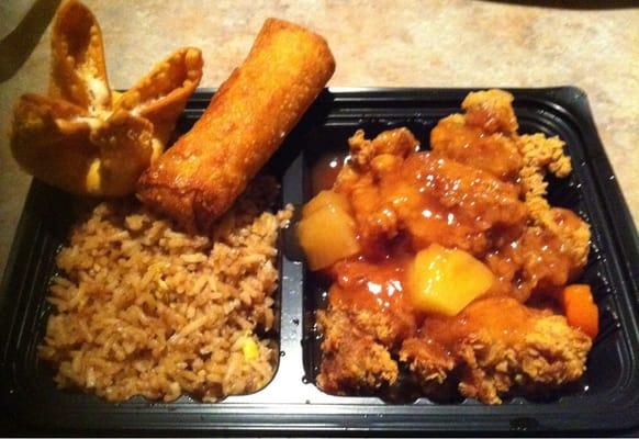 Sweet and sour chicken, fried rice, egg roll, and rangoon.