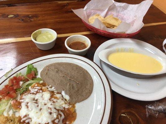 Two enchiladas ranchero style w/ rice and beans; chili con queso (small order $3.50) and fabulous salsas.