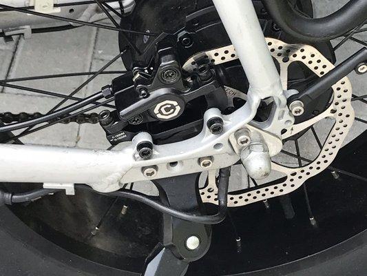 Front and rear hydraulic brake handles and brakes.