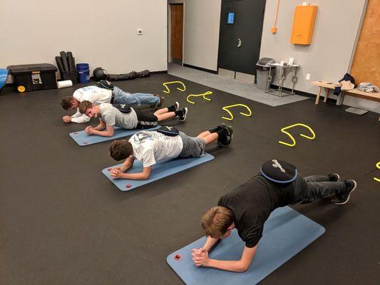 A dad planking with his kids!