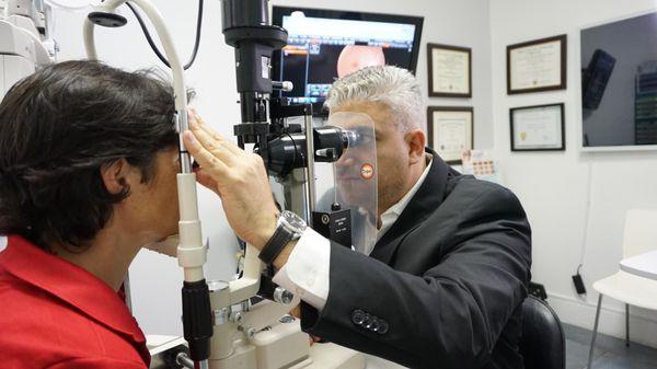 Dr Copty preforming 90 Diopter fundus evaluation