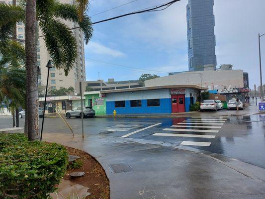 Corner of Waimanu & Kamakee you will find Harry's Cafe. Young Spa & Massage is the next door to the left.