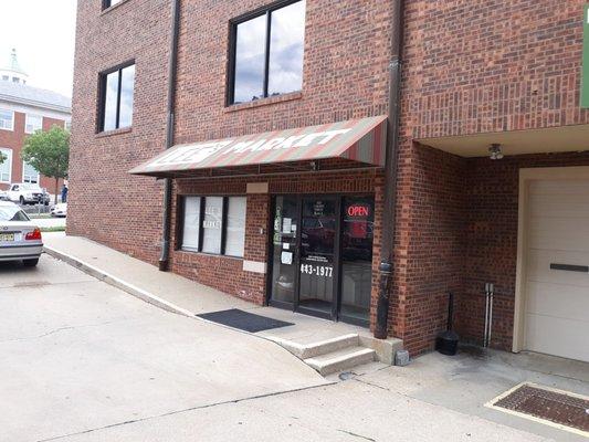 Store front, very small parking. Shop after he bank closes or on the weekends.