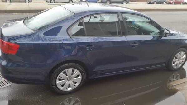 There was a huge deep scratch w/ slight indentation spanning both doors, & fender damage. This is my car after Sonny's fixed it