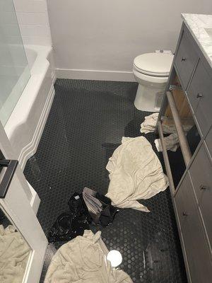 Flooding from broken pipe in bathroom.  More towels ruined.