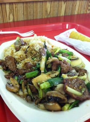 Yummy Mongolian Beef and egg roll.