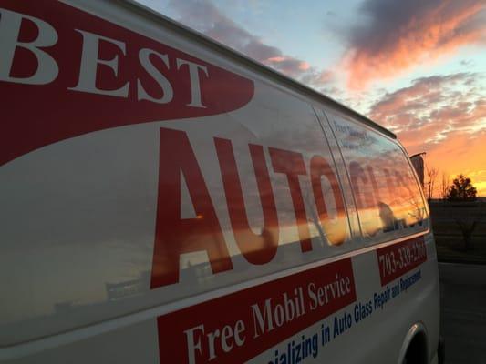 One of our company vans with just an absolutely beautiful background of a sunset.