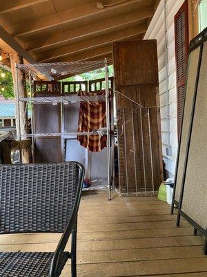 Storage area on porch that we were sat in even though there were tons of tables--felt like the stepchildren.