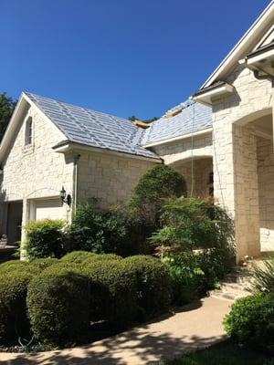 Production photos of full roof replacement in Austin.