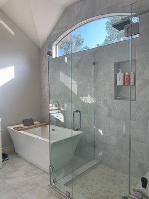 Shower, freestanding tub, wall tile, floor tile, making the most of small spaces.