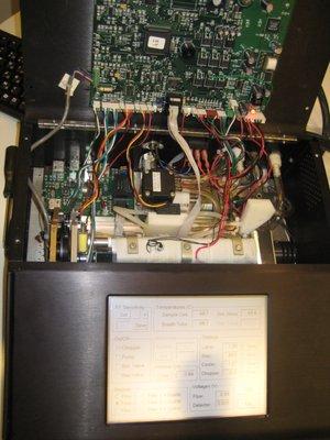 Inside of a desk-top breath testing device.  (Looks like a Commodore 64).