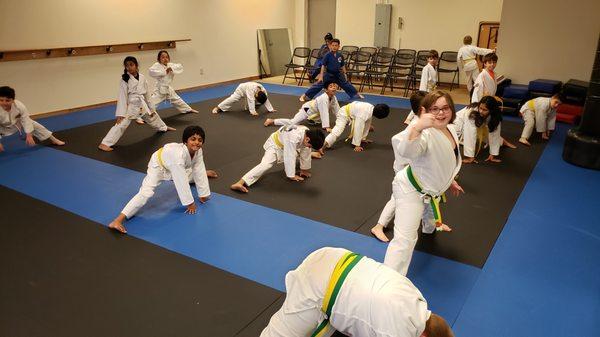 Stretches and warm up in our beginners martial arts class for 6 to 12 year olds