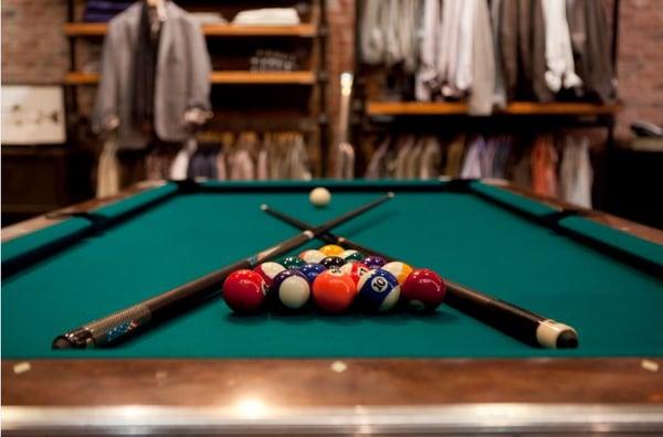 Play a game of pool while hanging at Q.