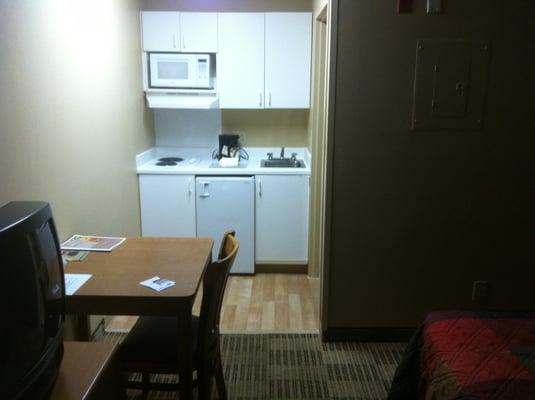 View of the kitchen standing next to the door and TV