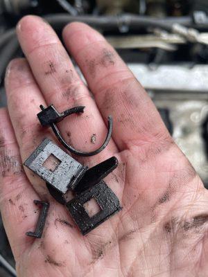 some of the pieces of the broken connector clip--fished out of the engine area
 BRAND NEW coil pack is not making proper contact with engine