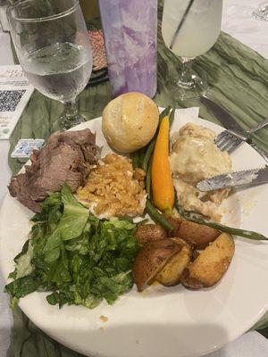 My plate of delicious food! Fish encrusted with yummy bread crumbs, prime rib, champagne Chicken