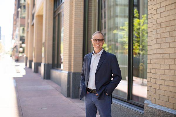 Dr. Rob Leach outside our LoDo office on the 16th Street Mall between Market and Blake.