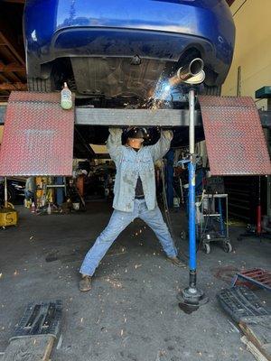 Felipe welding with all appropriate PPE on, like a pro!