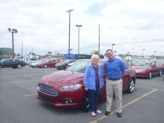 Cory Geesaman, Ford Salesperson with Mary and her new Fusion.