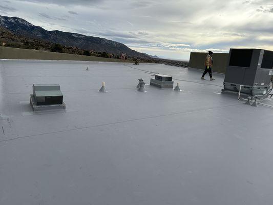 Commercial TPO roof installation.