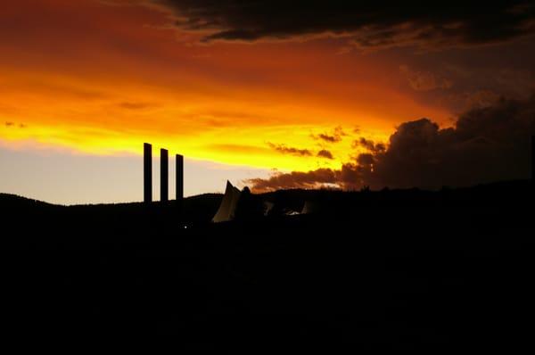 Memorial with storm in the distance.