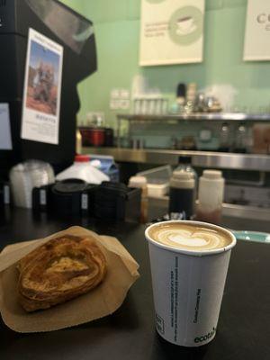 Latte and savory cheese and spinach pastry