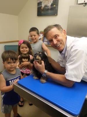 Dr. Blevins hamming it up with some very excited little ones.