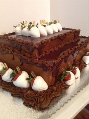 Custom Grooms Cake
 (Triple chocolate cake with buttercream and ganache, with infused Grand Marnier Chcolate covered Strawberries)