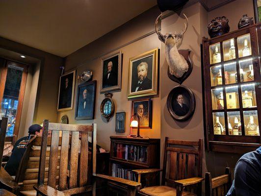 Inside. Cool decor. Old portraits and hunting trophies. Front of house.