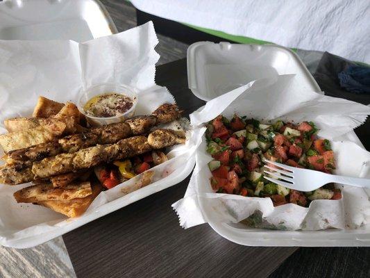 Chicken kebab with hummus, homemade pita chips, veggies, and cucumber salad