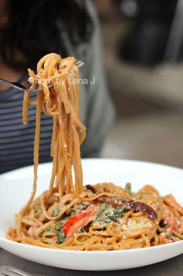 Seafood Carbonara ($28) - Linguini, shrimp, scallops, pork guanciale, confit garlic, peas, roasted peppers, spinach, parmesan, parsley