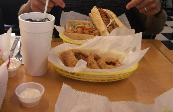 August 1, 2018 Onion rings in front, half Oyster and half Shrimp Poboy's in back.