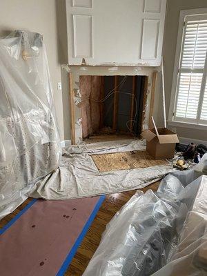 Removing the old fireplace.