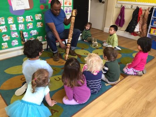 Mr. Rado sharing instruments in our 2's classroom.