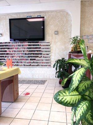 Sanitizing area, large selection of colors and TV while waiting to dry your nails. This is the front area.