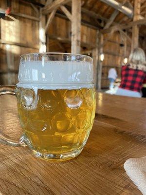 A frosty beer while sitting inside