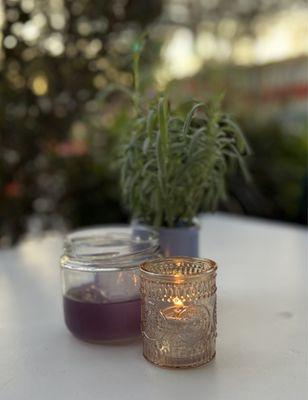 Patio table with lavender plant and Violet Milk Punch cocktail.