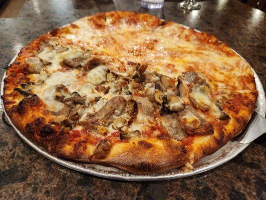 Thin crust cheese pizza, 1/2 mushroom and sausage.