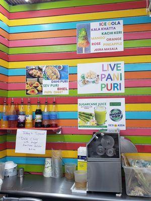 Sugar cane juicing machine and menu display.