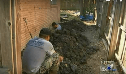 Crew at work digging tunnels for foundation repair through an exterior breakout; Featured on CBS News Channel 11