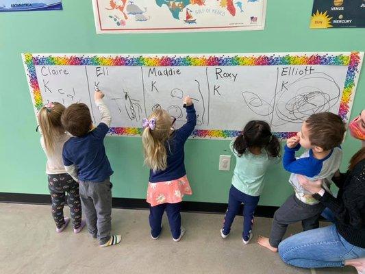 KO12 Preschool students learn how to write their names starting at 2 years old!